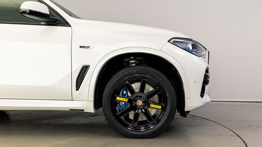 EZ Spare Wheel installed on BMW X5 with jack during emergency tire change