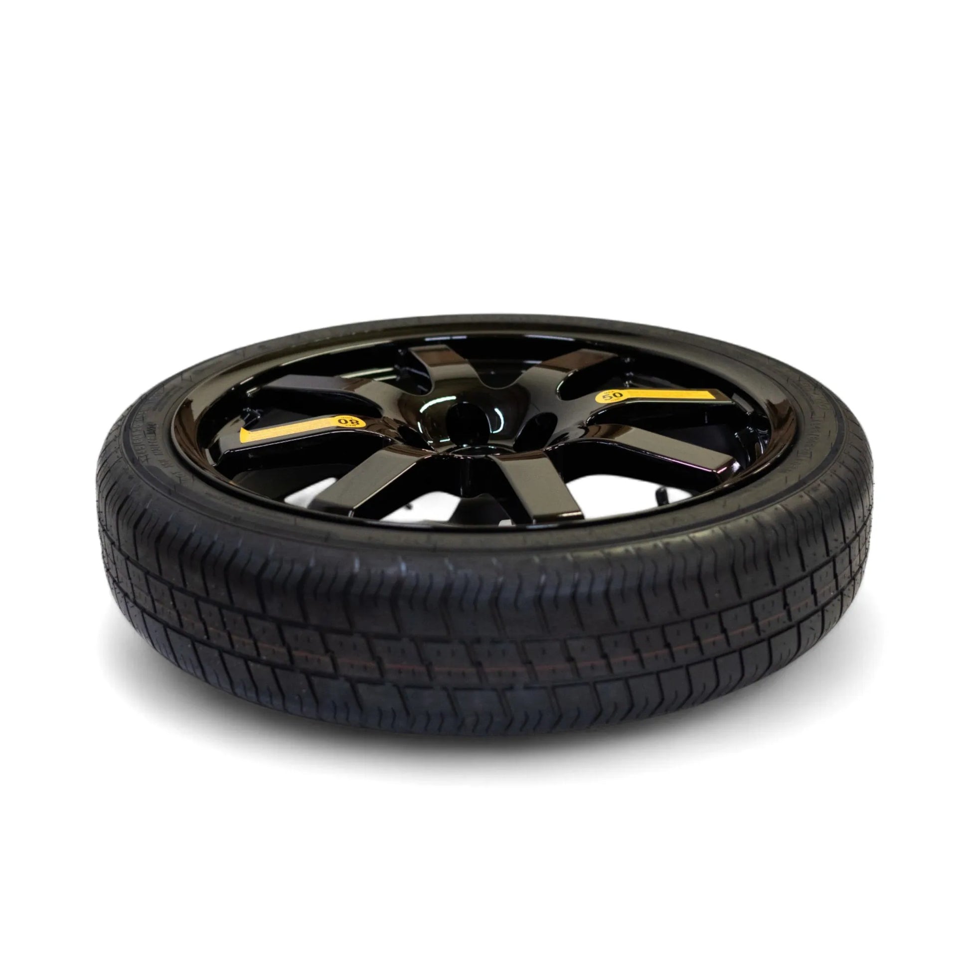 Overhead view of the 20-inch EZ Spare Wheel in black alloy, showcasing its compact and lightweight design.