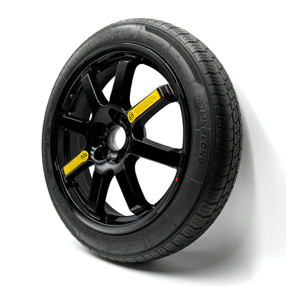 A compact spare tire with tire size 135/90r17 with black alloy wheel