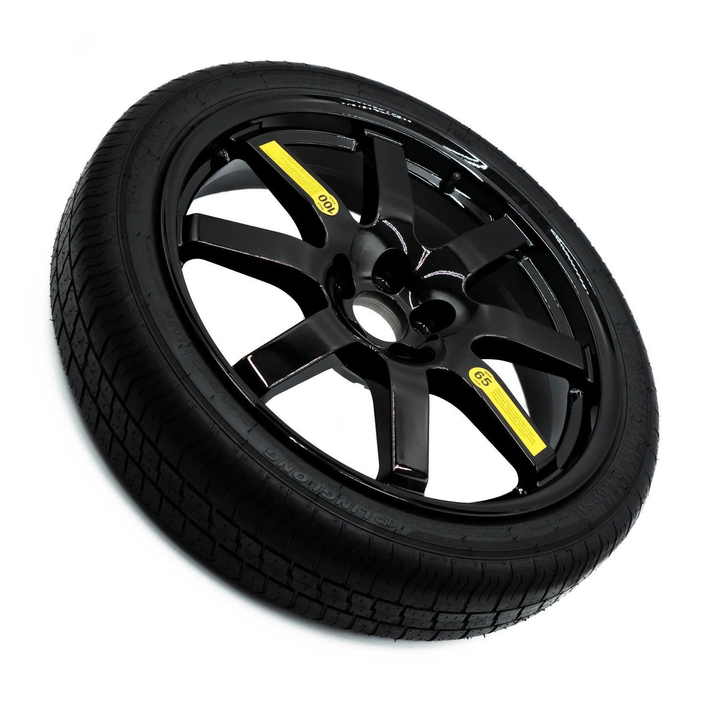 Top view of EZ Spare Wheel and Tire showing 65 mph temporary use label for emergency spare compatibility across most vehicles