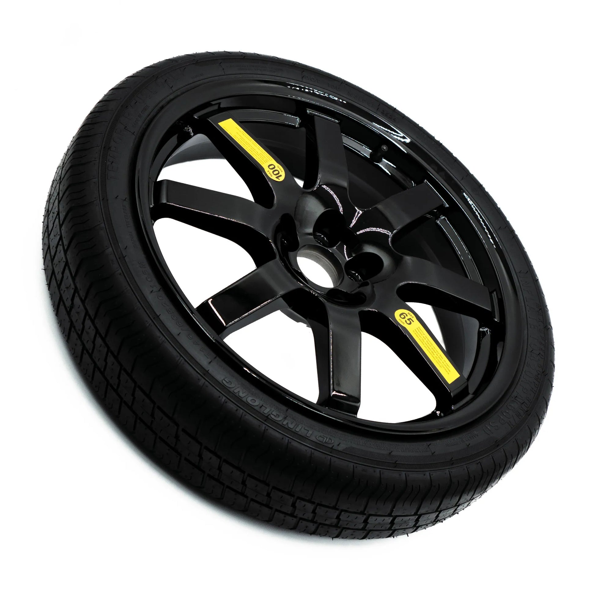 Top view of EZ Spare Wheel and Tire showing 65 mph temporary use label for emergency spare compatibility across most vehicles