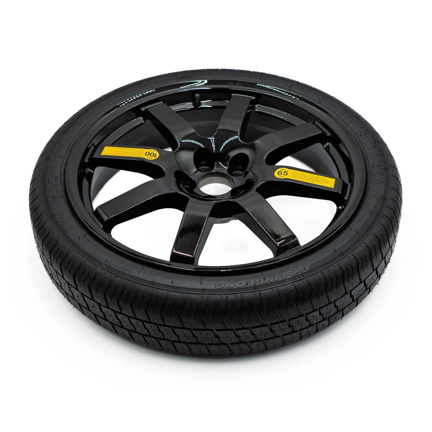 Top view of EZ Spare Wheel and Tire showing 65 mph temporary use label for emergency spare compatibility across most vehicles