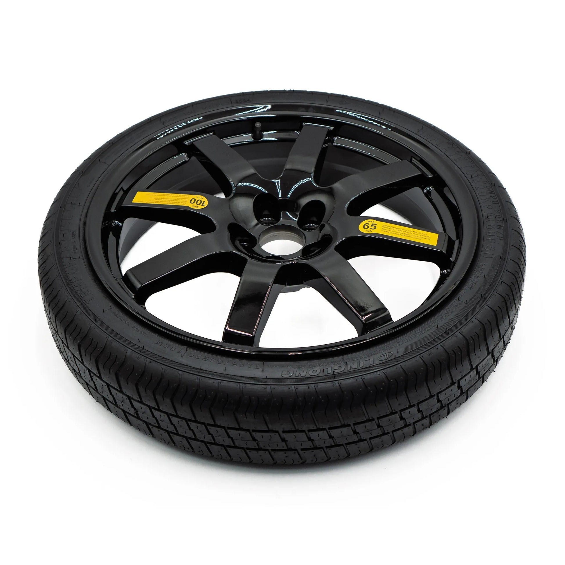 Top view of EZ Spare Wheel and Tire showing 65 mph temporary use label for emergency spare compatibility across most vehicles