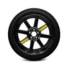 2016-2026 Lexus RX, Hybrid, Plug-In Hybrid, and F Sport models come with a temporary-use compact spare tire featuring a black alloy rim, along with speed and pressure warning labels.