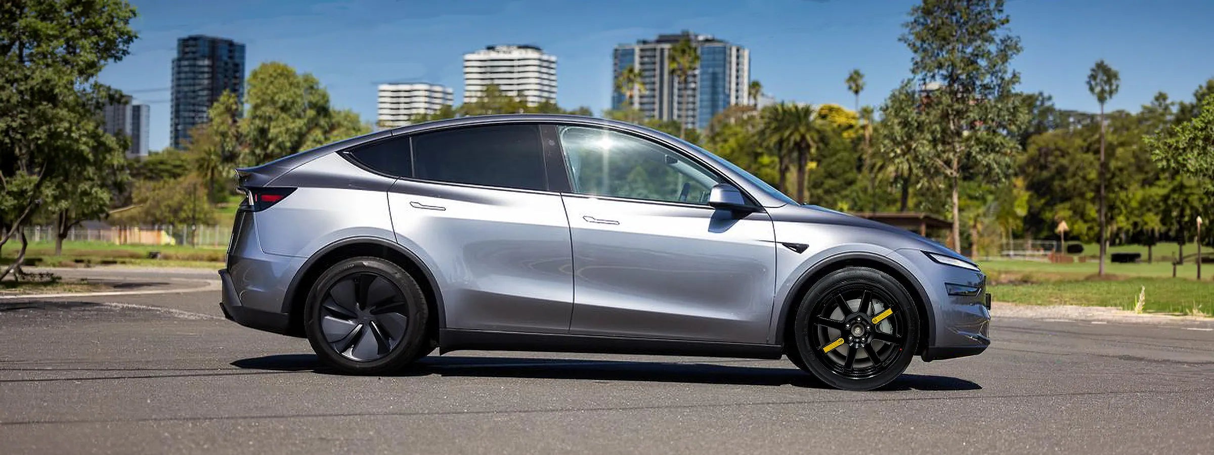 Tesla Model Y shown with an EZ Spare Wheel compact spare tire installed for temporary roadside use.